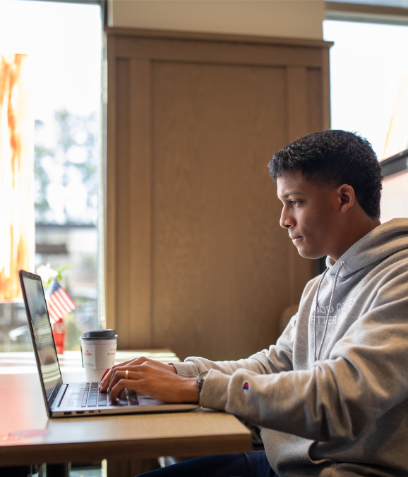 Chick-fil-A Team Member Studying on Laptop